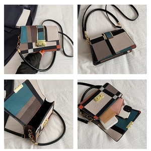 Detail view showing multi-color patchwork square bag with gold twist lock and interior space