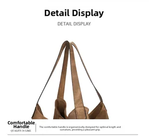 Detailed view of the ergonomic brown leather shoulder strap with soft premium texture