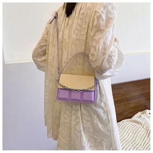 Fashionable purple and beige box bag with chocolate relief texture and silver chain strap