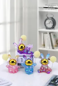 Detail of four colorful electroplated astronaut bunny statues with metallic mirror finish