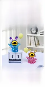 Detail of creative astronaut rabbit figurine with gradient metallic finish and golden helmet
