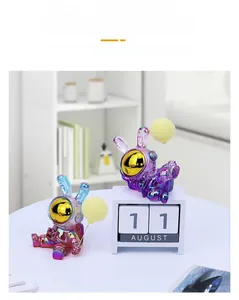 Detail of creative electroplated purple astronaut rabbit figurine with gold visor and balloon