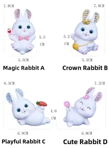 Detailed view of four resin rabbit figurines with sparkling rhinestone-inlaid ears