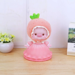 Cute pink pig piggy bank wearing a strawberry plush hat and dress for home decor