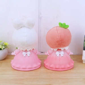 Cute pig plush piggy bank toys in pink lace dresses shown from a rear view layout