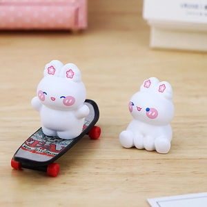 Cute white bunny resin figurines for car dashboard and desk decor with mini skateboard
