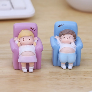 Cute resin couple figurines sitting on sofas with playful expressions for car and desk