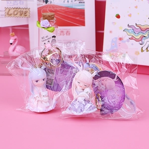 Cute cartoon girl resin keychain set with small white cat charms and pink hanging hooks