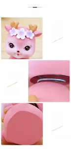 Close-up of pink deer bobblehead showing the neck spring design for dashboard decor