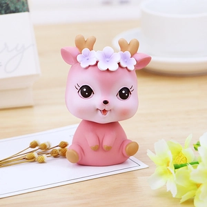 Cute pink cartoon deer figurine with heart horns and flower crown for car dashboard