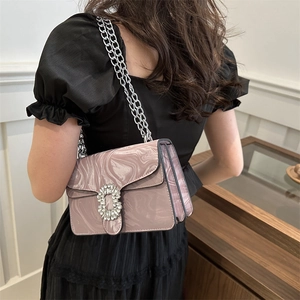 Pink marble pattern chain bag for women featuring rhinestone buckle in a crossbody style