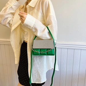 Stylish green quilted shoulder bag with textured flap and chunky silver chain strap for women