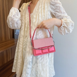 Pink chocolate square crossbody bag with silver chain strap and textured leather finish