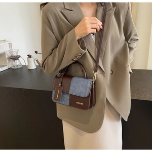 Retro color-block crossbody bag in brown leather and blue denim with shoulder strap