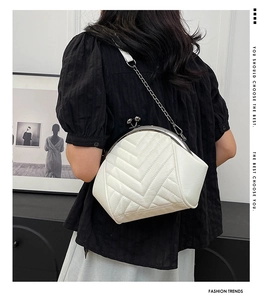 Modern white PU leather shell bag with V-quilted texture and metal clasp closure