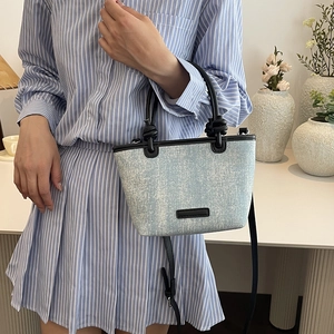 Blue denim mini bucket bag with sparkling sequins and black leather straps for women