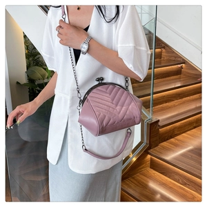 Chic quilted purple leather crossbody shell bag with retro metal clasp and chain strap