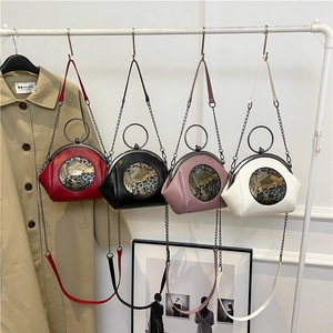 Set of four contrast shell handbags in red, black, pink and white with metal chain handles