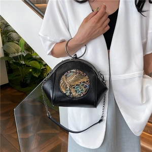 Retro black leather shell bag with metal elephant relief and large silver ring handle