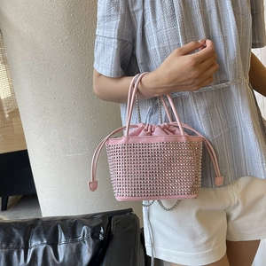 Pink rhinestone bucket bag with drawstring closure and silver chain strap for women