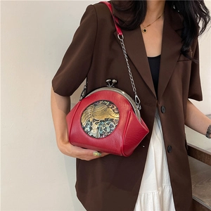 Retro red crossbody shell bag with elephant relief and silver chain strap