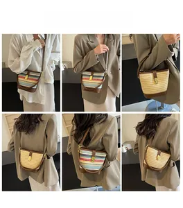 Detail showing woven straw bucket bag with leather handles and metallic buckle lock
