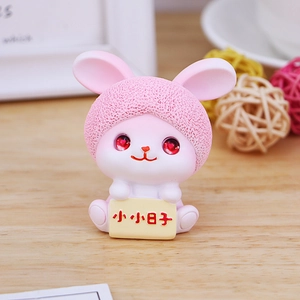 Cute pink resin rabbit figurine with ruby eyes for creative home or office desk decor