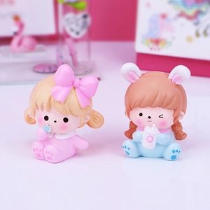 Cute resin girl figurines for car and desk decor featuring pink and blue outfits