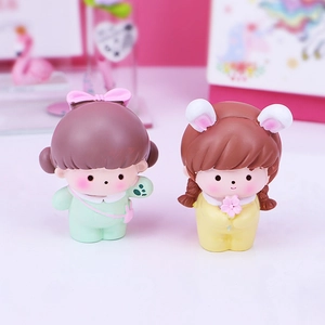 Cute cartoon girl resin figures in mint green and yellow outfits for desk or car decor