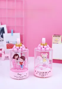 Pink carousel music box with LED lights and cute figurines for romantic room decoration
