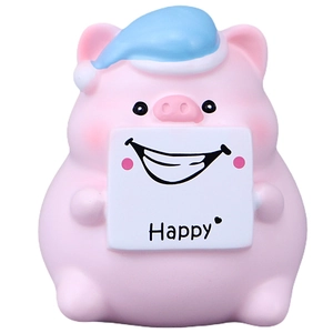 Simpatica statuina da scrivania a forma di maiale rosa con cappello blu e scritta Happy