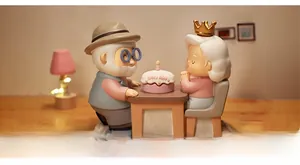 Macro detail of resin elderly couple figurines celebrating with a birthday cake