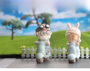 Macro detail of resin elderly couple figurines on retro motorbikes for wedding gifts