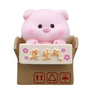 Cute pink pig in cardboard box desk ornament with Don't Get Angry sign for stress relief