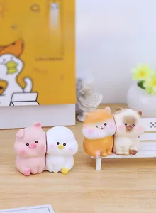 Detailed view of cute resin animal ornaments with magnetic suction on wooden surface