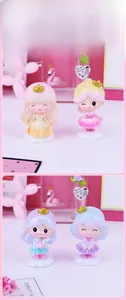 Detailed close-up of four cute princess figurines with golden crowns on cloud bases