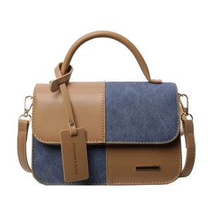 Contrast stitching handbag in camel leather and blue denim with a top handle