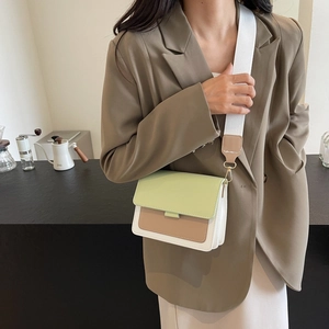 Three-color patchwork leather crossbody bag with wide strap on modern model