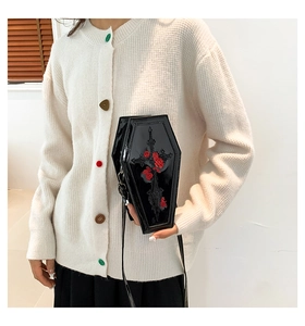 Detailed embroidery of red roses and a black cross on gothic PU leather coffin bag