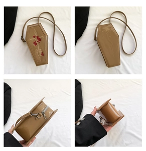 Gothic coffin-shaped shoulder bag featuring detailed cross and red rose embroidery