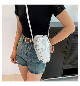 Gothic white coffin cross-body bag featuring blue rose embroidery and silver stud detail