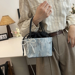 Sequin canvas bucket bag with pearl bow charm and silver chain strap for women