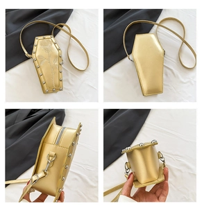 Detail view of gold coffin bag featuring rose embossing and silver metallic rivets