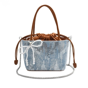 Blue denim bucket bag with silver sequins, pearl bow charm and chain strap