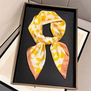 Elegant silk-textured square scarf featuring yellow and white floral geometric patterns