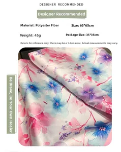 Detailed view of polyester floral scarf measuring 65x65cm with soft watercolor prints