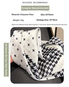 Macro detail of houndstooth pattern silk scarf with 65x65cm dimensions and fine texture