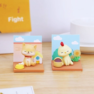 Miniature Shiba Inu and chick figurines set on a desktop with a blue sky background