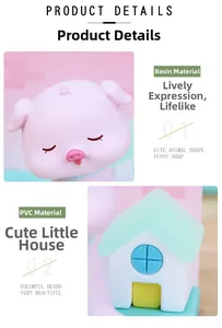 Detail of resin cartoon pig and miniature house ornament in macaron colors