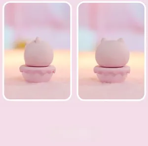 Detail view of a pink cartoon pet tumbler ornament with soft matte silicone texture
